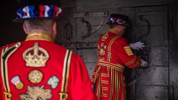 LONDON, ENGLAND - JULY 10: A Yeoman Warder locks the smaller hatch on the Middle Gate ahead of a ceremonial event to mark the reopening to the public of the Tower of London on July 10, 2020 in London, England. As the British Government continues to relax the Coronavirus restrictions, tourism hotspots such as the Tower of London are re-opening their doors, hoping to draw in visitors on the opportunity to see the sights during these much quieter times. (Photo by Leon Neal/Getty Images)