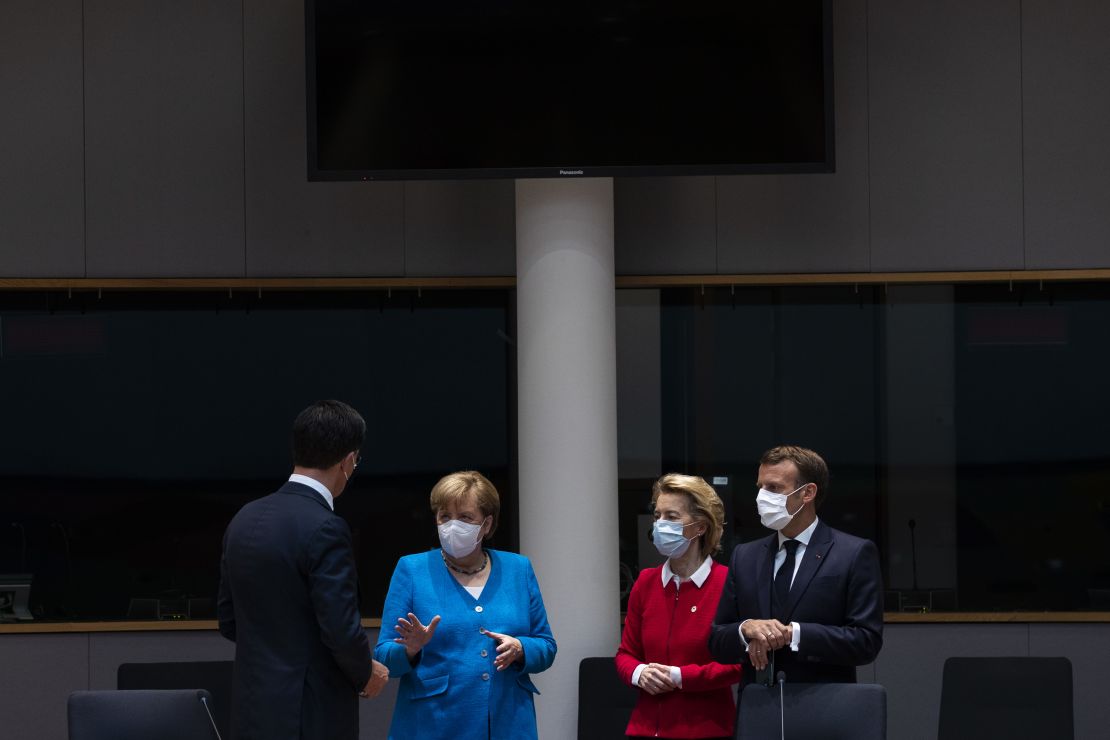 Netherlands' Prime Minister Mark Rutte, left, talks with Germany's Chancellor Angela Merkel, President of the European Commission Ursula von der Leyen and France's President Emmanuel Macron at the summit.