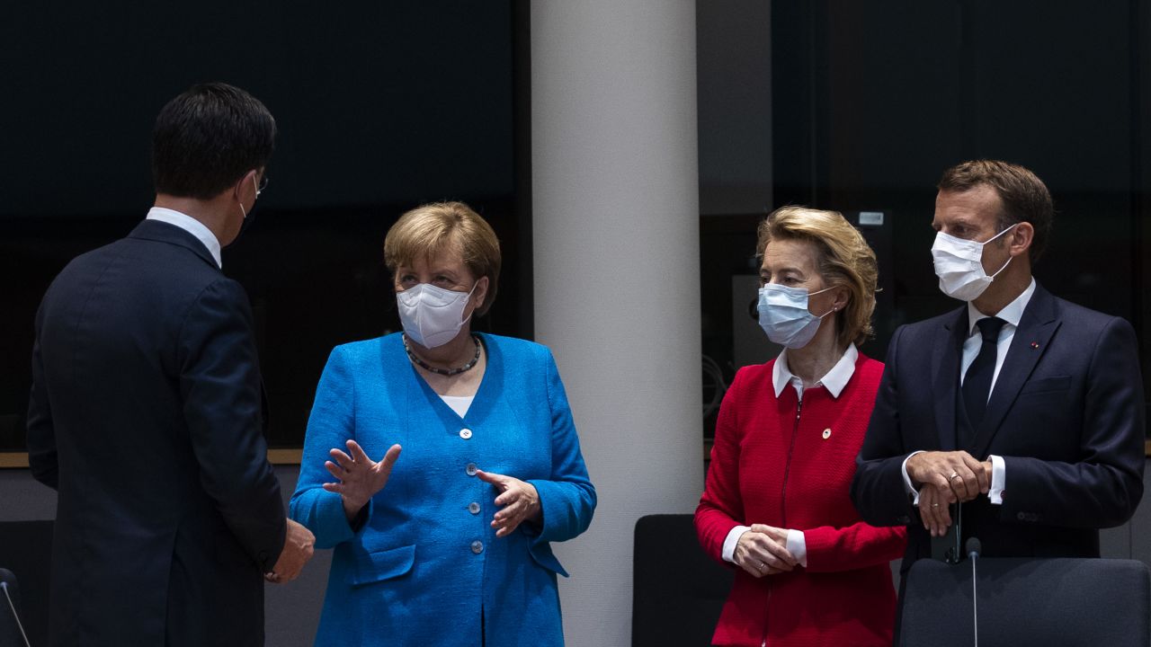 Netherlands' Prime Minister Mark Rutte, left, talks with Germany's Chancellor Angela Merkel, President of the European Commission Ursula von der Leyen and France's President Emmanuel Macron at the summit.