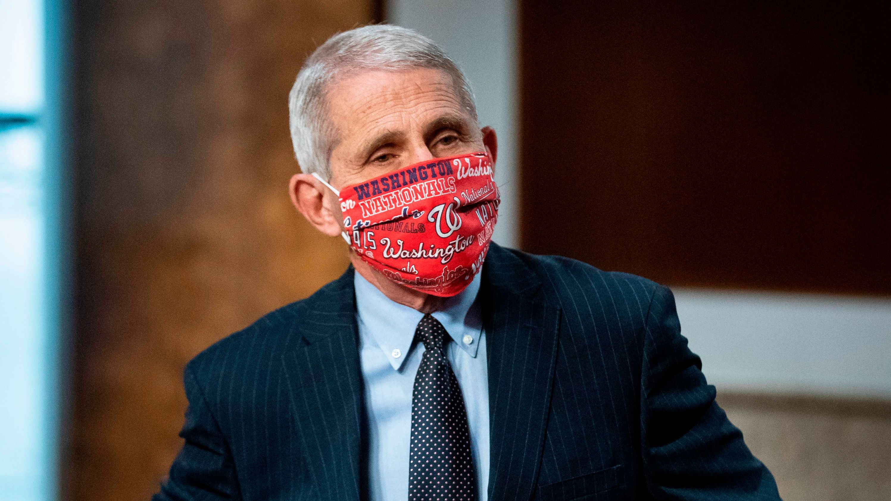 Anthony Fauci, director of the National Institute of Allergy and Infectious Diseases, wears a Washington Nationals face covering as he arrives during a Senate Health, Education, Labor and Pensions Committee hearing in Washington, DC, on June 30. 