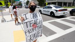 Middle-school teacher Brittany Myers takes part in a protest Thursday in front of the Hillsborough County Schools District Office in Tampa, Florida. 