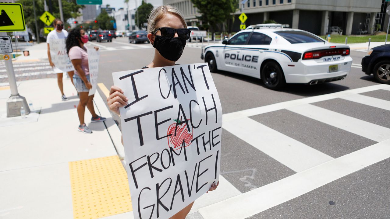 Middle-school teacher Brittany Myers takes part in a protest in July in front of the Hillsborough County Public Schools office in Tampa, Florida.