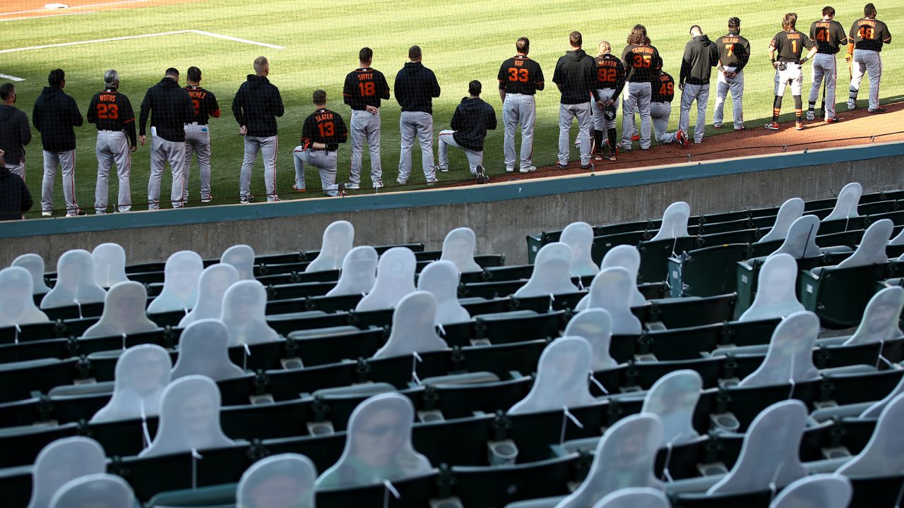 San Francisco Giants players seen kneeling during the national anthem  on July 20.