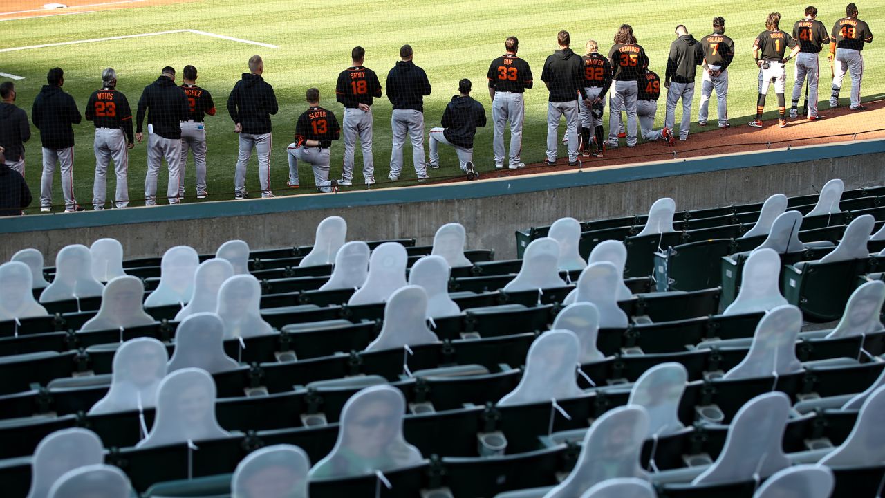 San Francisco Giants players seen kneeling during the national anthem on July 20.