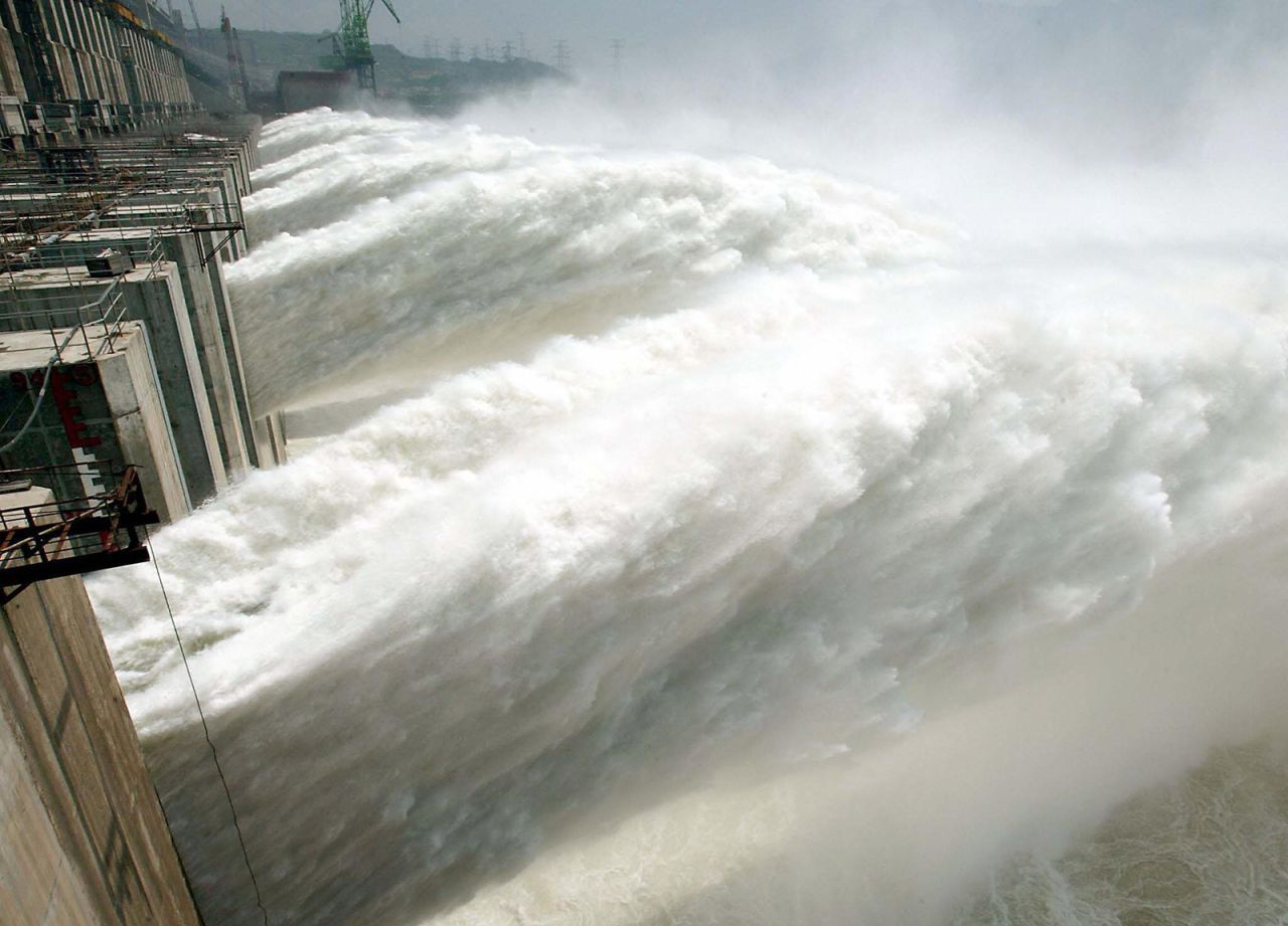 Water gushes out through the Three Gorges Dam for the first time on June 11, 2003. 