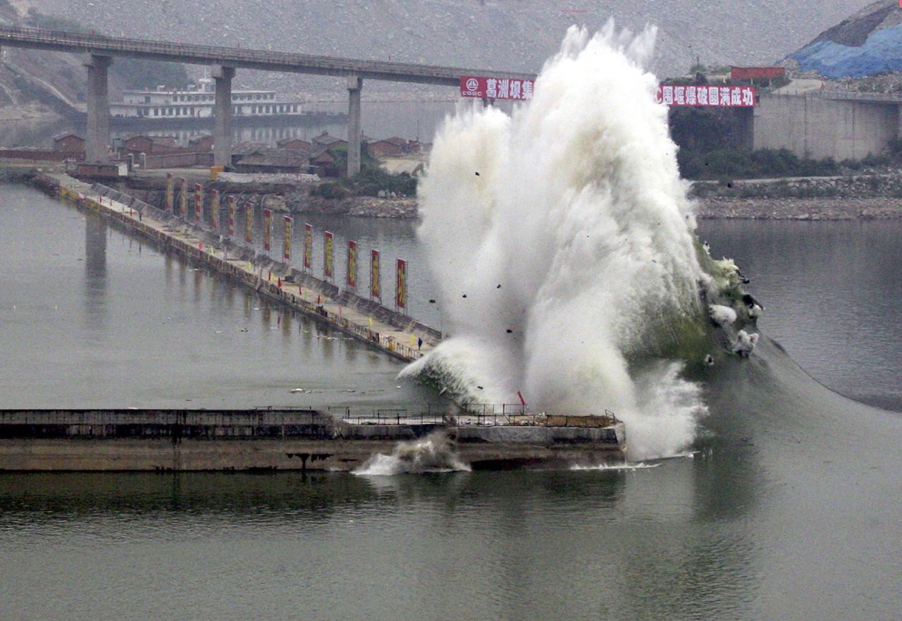 The cofferdam protecting the main wall of the Three Gorges Dam is blown up from underwater on June 6, 2006. The removal of the cofferdam allowed the Three Gorges Dam to formally start its role in flood control.