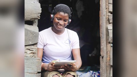 Margaret Okpoe learning virtually on her tablet.