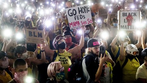 Hundreds of people shine light from their cell phones during a protest on July 20.