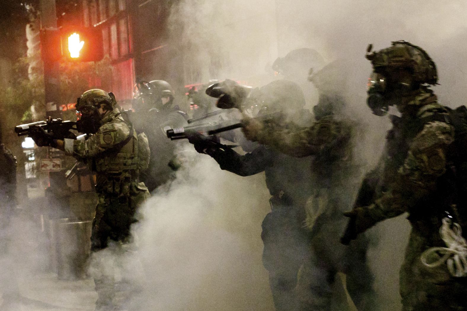 Federal agents try to push back demonstrators on July 16.