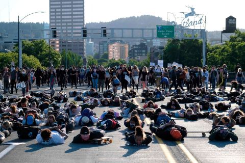 Protesters lie down on the Burnside Bridge during a moment of silence on June 1.
