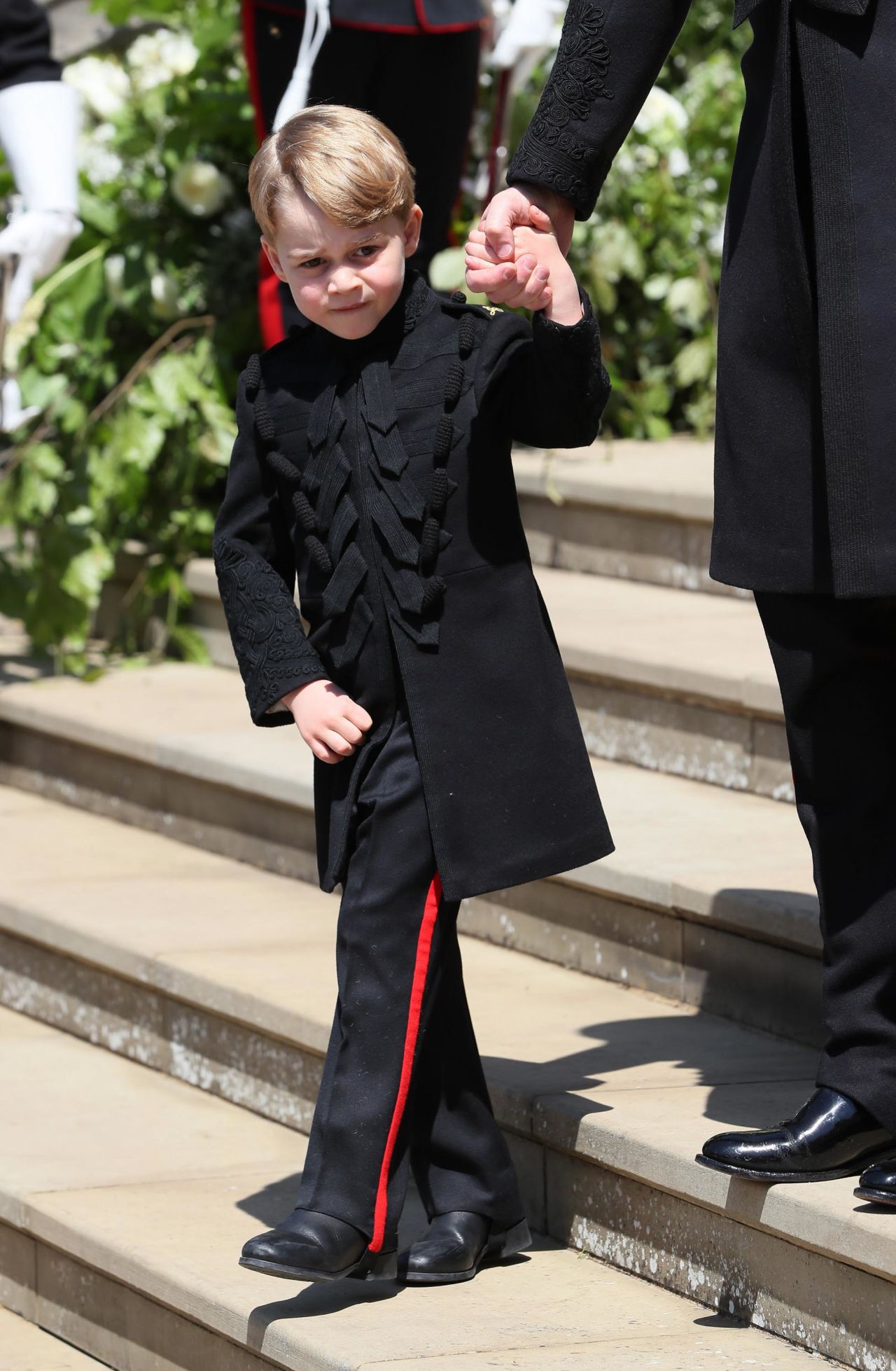 Prince George leaves the chapel after the wedding of his uncle, Prince Harry, in May 2018.