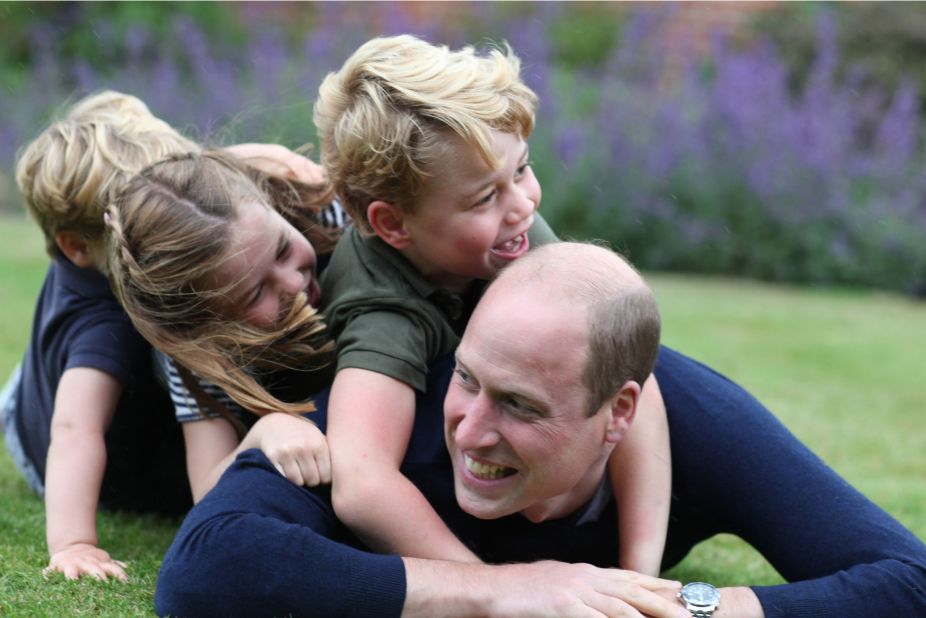 George and his younger siblings, Charlotte and Louis, play with their father in June 2020.