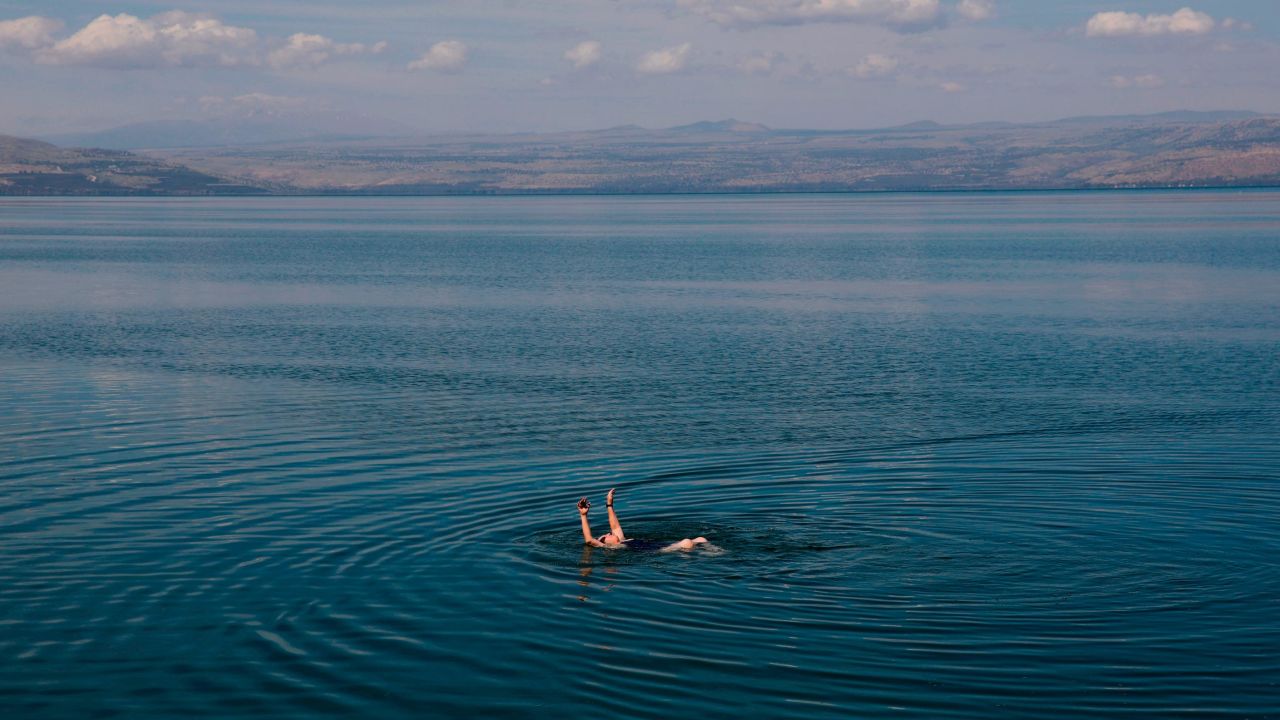 <strong>Sea of Galilee, Israel:</strong> A lone swimmer enjoys the Sea of Galilee in May 2020. As of July 2020, Israel remains closed to non-citizens and non-residents. 