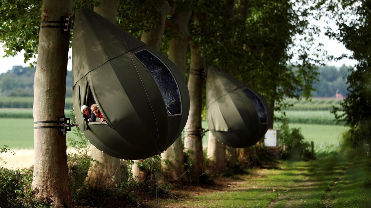 <strong>Borgloon, Belgium:</strong> These teardrop-shaped tents created by Dutch artist Dre Wapenaar offer tourists a treehouse-style experience. Pictured early July. 
