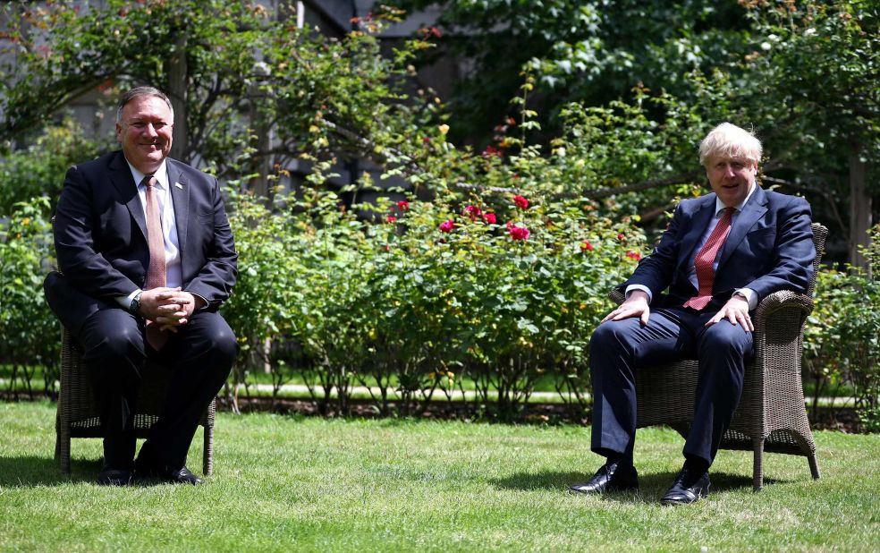 US Secretary of State Mike Pompeo sits across from Johnson in the garden of No. 10 Downing Street in July 2020.
