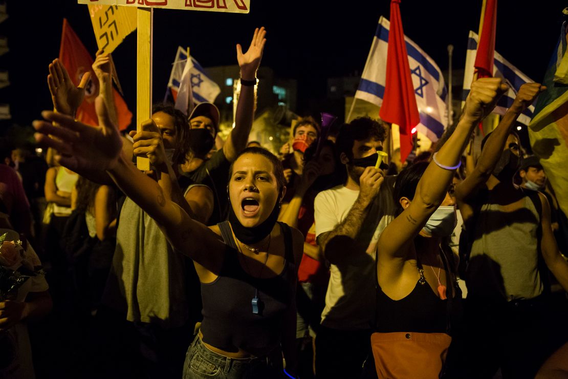 Crowds protest Netanyahu's handling of the pandemic in Jerualem in July.