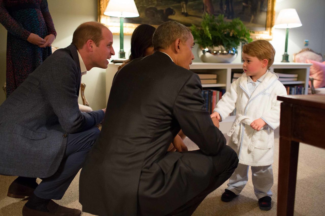 Prince George shakes hands with US President Barack Obama while Obama visited Kensington Palace in April 2016.