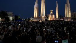 Protesters hold up their mobile phones during an anti-government demonstration at Democracy Monument in Bangkok on July 18, 2020. - Thousands of mainly young and black-clad Thai protesters converged on July 18 at Bangkok's Democracy Monument, in the largest and rowdiest anti-government protest in years which stretched deep into the night. (Photo by Aidan JONES / AFP) (Photo by AIDAN JONES/AFP via Getty Images)