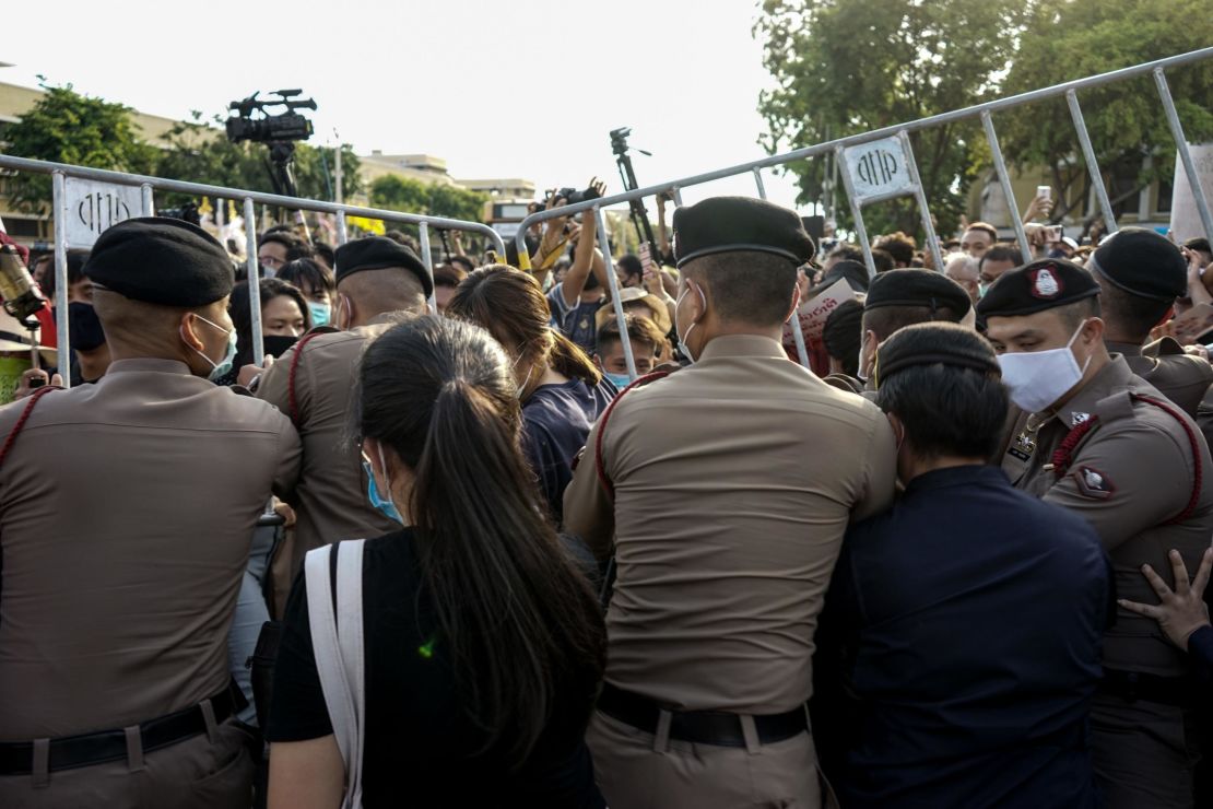 Police attempt to hold back protesters from entering the Democracy Monument to hold an anti-government demonstration in Bangkok on July 18.