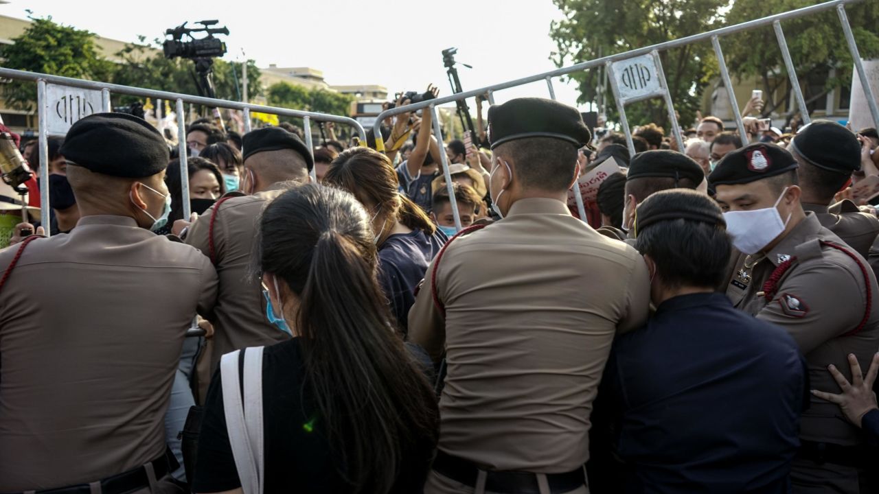 Police attempt to hold back protesters from entering the Democracy Monument to hold an anti-government demonstration in Bangkok on July 18.