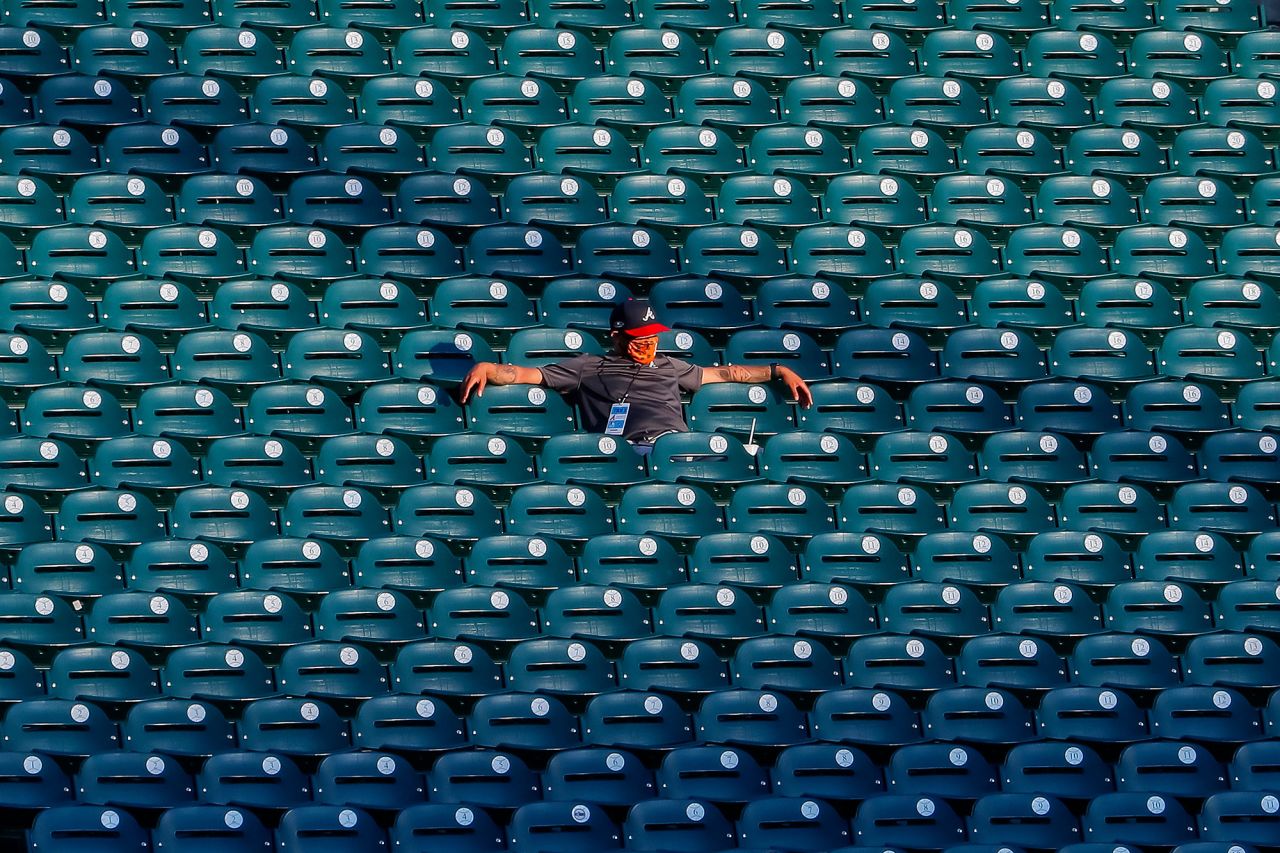 A stadium worker watches an Atlanta Braves scrimmage on July 13.