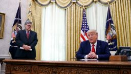 President Donald Trump speaks alongside Attorney General William Barr during a a law enforcement briefing on the MS-13 gang in the Oval Office of the White House, Wednesday, July 15, 2020, in Washington. (AP Photo/Patrick Semansky)