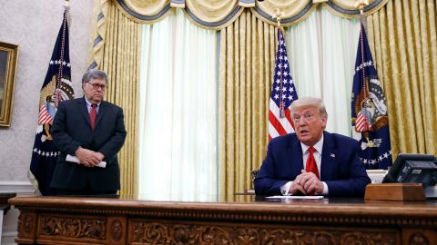 President Donald Trump speaks alongside Attorney General William Barr during a law enforcement briefing on the MS-13 gang in the Oval Office of the White House, Wednesday, July 15.