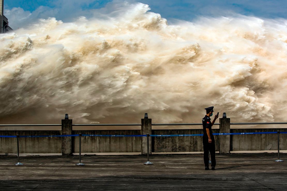 FILE--Floodwaters gush out of the Three Gorges Dam during a flood