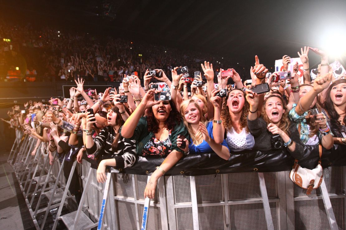 Fans watch One Direction perform at the BBC Teen Awards at Wembley arena on October 9, 2011 in London. 