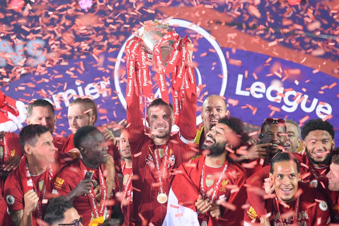 Jordan Henderson lifts the Premier League trophy after Liverpool's victory over Chelsea. 