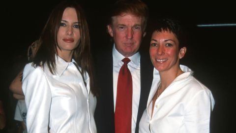 From left, Melania Knauss (later Melania Trump), Donald Trump and Ghislaine Maxwell pose together during the Anand Jon Fashion Show, New York, September 2000.