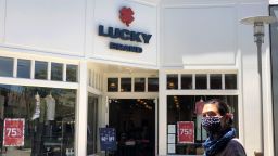 A pedestrian walks by a Lucky Brand retail store on July 06, 2020 in Corte Madera, California. Los Angeles based Lucky Brand Dungarees announced that it has filed for Chapter 11 bankruptcy as the company is millions of dollars in debt. The retailer will close 13 of its 200 retail stores.