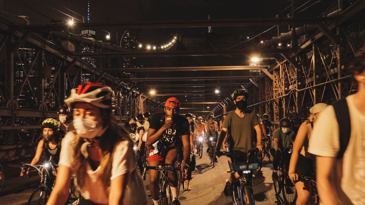 Tyrell Taylor, pictured center in the red hat, leads Black Lives Matter protests on bikes. 