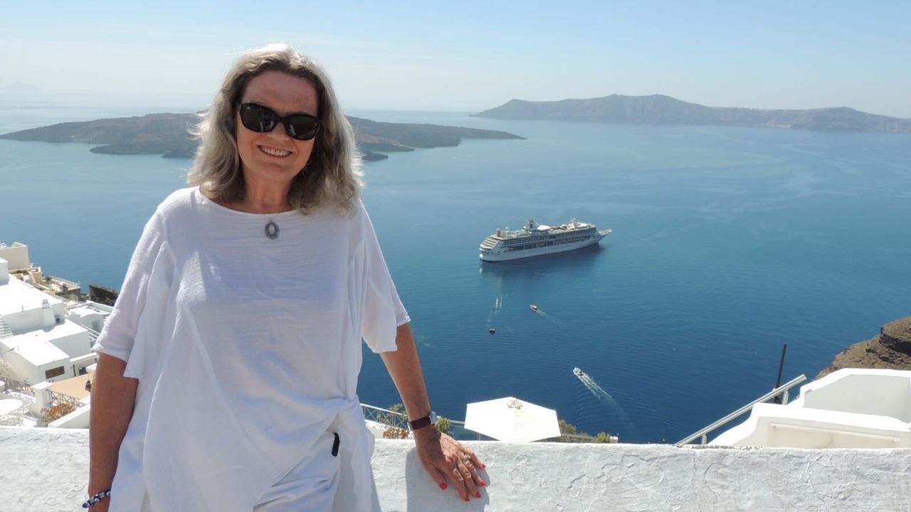 Cruise fan Christine Beehler on a cruise stop in Santorini, Greece a couple of years ago.
