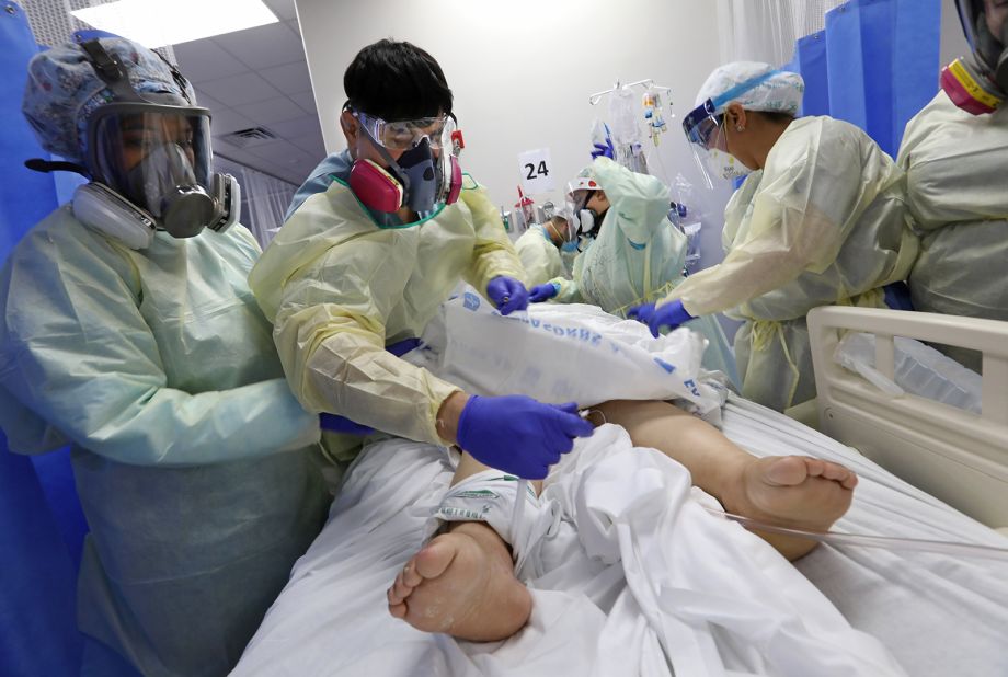 Nurse Gabriel Leyva, second from left, treats a coronavirus patient in Edinburg, Texas, on July 20. Texas is among a string of Southern states <a href="https://www.cnn.com/2020/07/22/politics/chip-roy-texas-coronavirus-cnntv/index.html" target="_blank">grappling with rising coronavirus cases.</a>