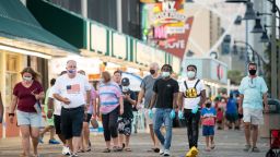 MYRTLE BEACH, SC - JULY 04: People walk on the boardwalk on July 4, 2020 in Myrtle Beach, South Carolina. Vacationers traveled to the SC beach despite growing concerns about the the spread of COVID-19. (Photo by Sean Rayford/Getty Images)