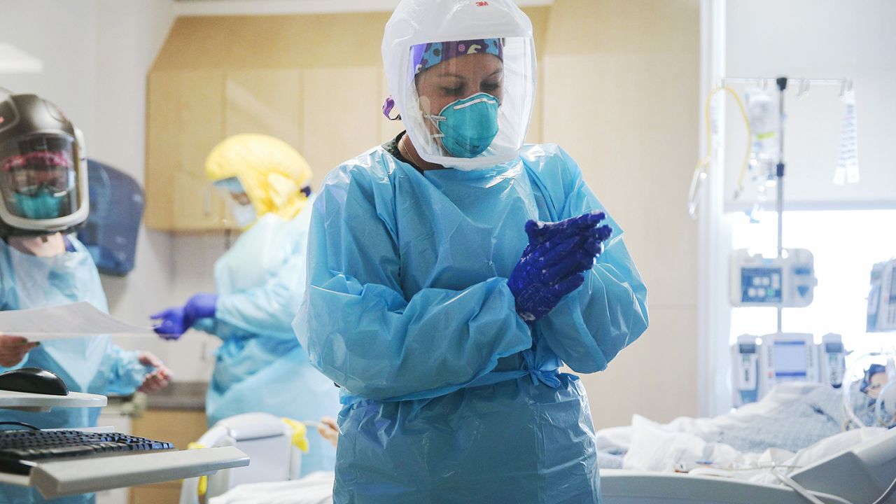 EL CENTRO, CALIFORNIA - JULY 21: Clinicians care for a COVID-19 patient in the Intensive Care Unit (ICU) at El Centro Regional Medical Center in hard-hit Imperial County on July 21, 2020 in El Centro, California. Imperial County currently suffers from the highest death rate and near-highest infection rate from COVID-19 in California. The rural county, which is 85 percent Latino, borders Mexico and Arizona and endures high poverty rates and air pollution while also being medically underserved. In California, Latinos make up about 39 percent of the population but account for 55 percent of confirmed coronavirus cases amid the pandemic. (Photo by Mario Tama/Getty Images)