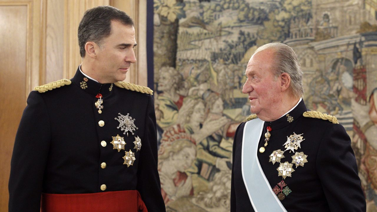 Former King Juan Carlos (right) told his son King Felipe VI of Spain (left) that he is moving out of the country