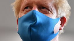 LONDON, UNITED KINGDOM - JULY 13: Britain's Prime Minister Boris Johnson, wearing a face mask or covering due to the COVID-19 pandemic, visits the headquarters of the London Ambulance Service NHS Trust  on July 13, 2020 in London, England.  (Photo by Ben Stansall-WPA Pool/Getty Images)