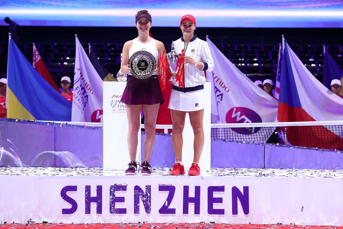Champion Ashleigh Barty and Elina Svitolina pose with their trophies after the WTA Finals in 2019. 