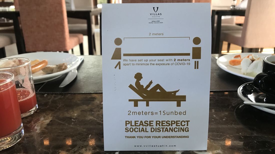 <strong>Keep your distance: </strong>Signs placed on the tables at V Villas' Villazzo restaurant outline the resort's new seating policies. 