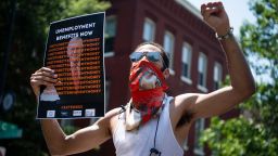Demonstrators rally near the Capitol Hill residence of Senate Majority Leader Mitch McConnell, R-Ky., to call for the extension of unemployment benefits on Wednesday, July 22, 2020. The benefit, created by the CARES Act, is set to expire on July 31. 