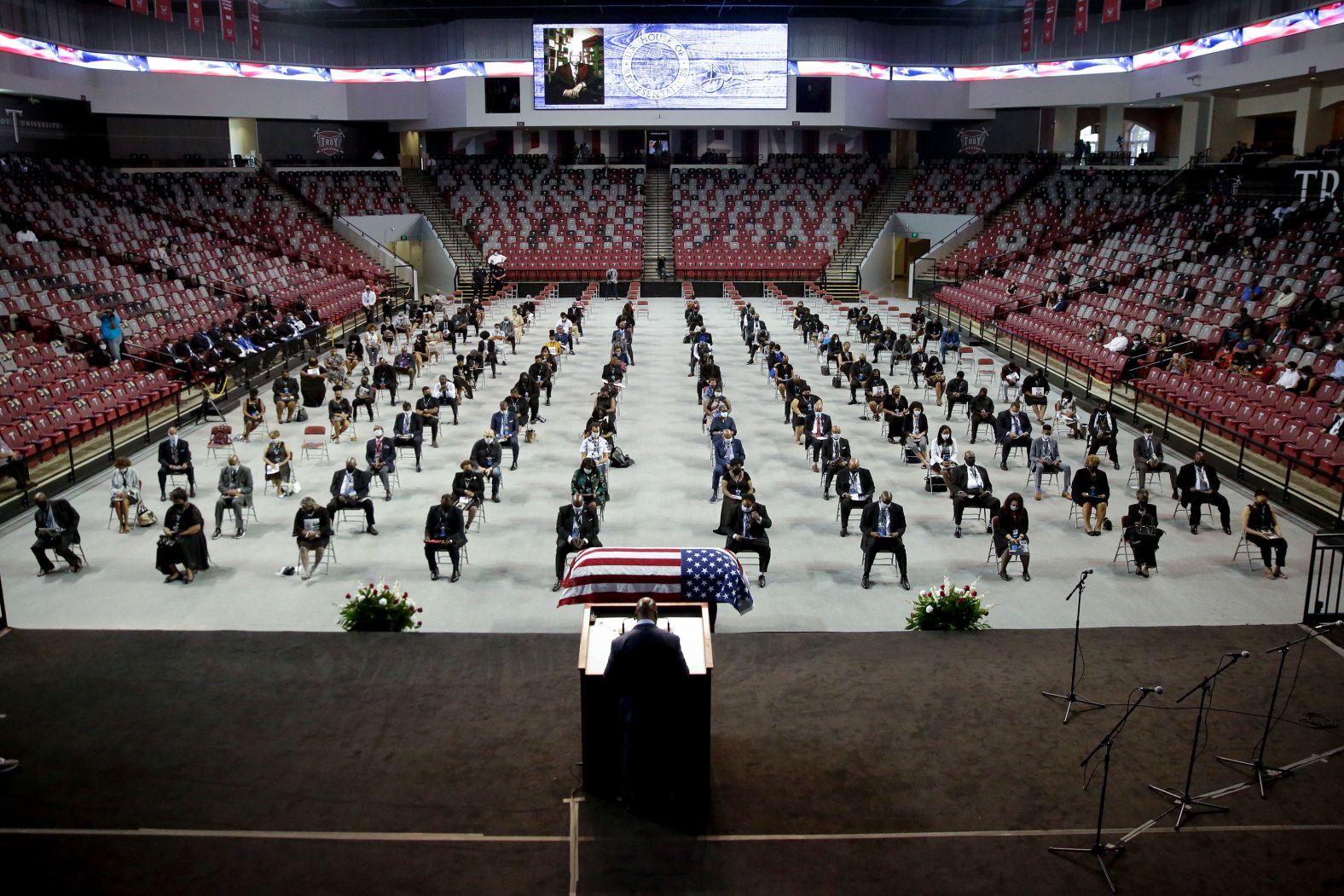 The Rev. Darryl Caldwell speaks as Lewis lies in repose during a service in Troy, Alabama, on Saturday. Lewis was born just outside of Troy.