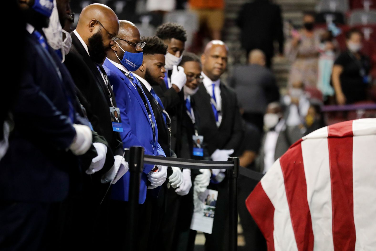 Fraternity members sing in front of Lewis' casket at the service in Troy.