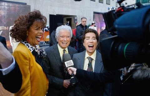 Hoda Kotbe, at left dressed as Kathie Lee Gifford, Regis Philbin, and Kathie Lee Gifford dressed as Philbin, attend NBC's "Today" show at Rockefeller Plaza  in New York City on October 31, 2016.
