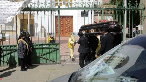 Funeral workers carry a coffin during a funeral in La Paz.