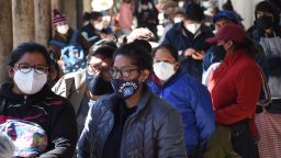 Bolivians line up outside a pharmacy in Cochabamba.