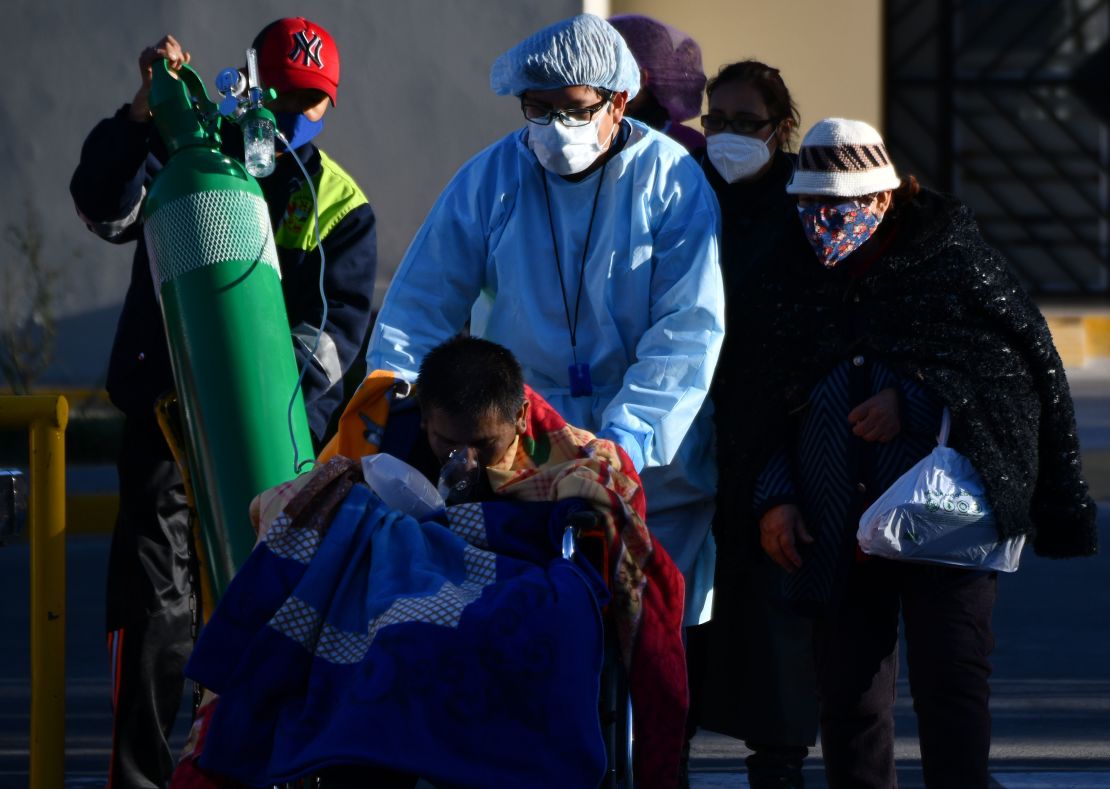 A nurse helps a Covid-19 patient outside a hospital in the city of Arequipa, Peru, on July 23, 2020.