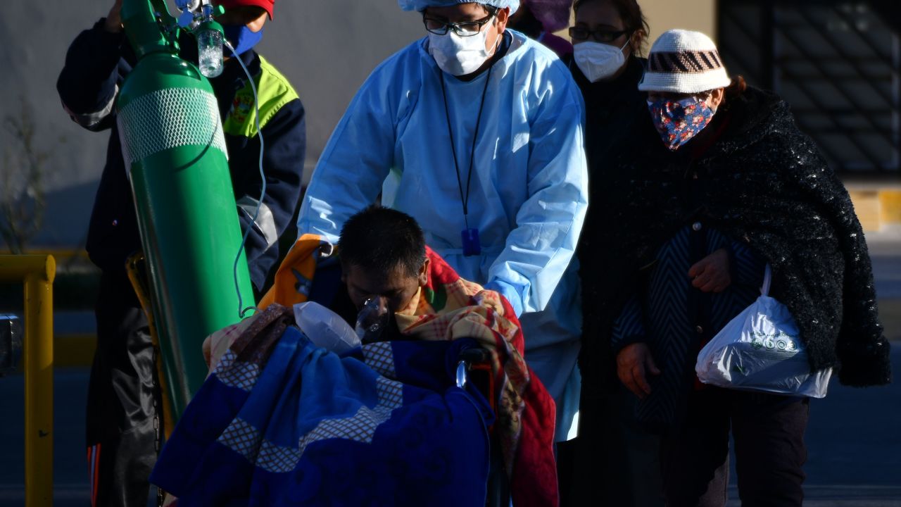 A nurse helps a Covid-19 patient outside a hospital in the city of Arequipa, Peru, on July 23, 2020.