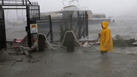 Jame Rowles examines the damage after the docks at the marina where his boat was secured were destroyed as Hurricane Hanna made landfall, Saturday, July 25, 2020, in Corpus Christi, Texas.
